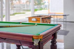 a pool table with a box on top of it at Decifer Sport Resort in Belas