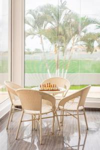 a chess game on a table in a room with chairs at Decifer Sport Resort in Belas