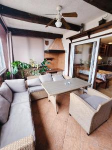 a living room with a couch and a table at Apartment Vanessa in Krk +24 photos