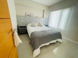 En eller flere senge i et værelse på Exclusivo a Estrenar - Terrazas al Golfo + 34 billeder