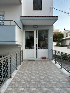 a front door of a house with a walkway at Evelyn's Cozy Apartment in Rhodes Town