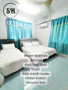 Postel nebo postele na pokoji v ubytování Simba Homestay Kemaman