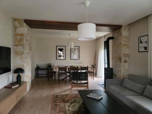 a living room with a couch and a table at Casa L in Ulcinj