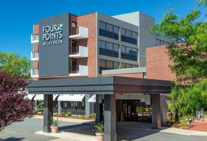 a rendering of the front of the four points building at Four Points by Sheraton Norwood Conference Center in Norwood
