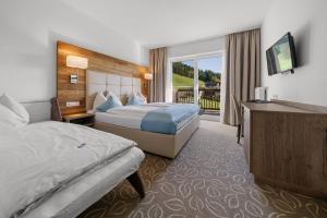 Postel nebo postele na pokoji v ubytování Landhotel Berger + 37 fotografií