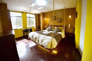 a bedroom with a swing bed in a room at Wifala Thematic Hotel Boutique in Cusco
