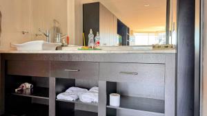 a bathroom with a sink and a mirror at Edificio Tofino in Quito +241 photos