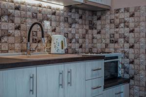 a kitchen with a sink and a counter top at House Christina in Vourvourou