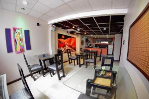 an empty dining room with tables and chairs at Wifala Thematic Hotel Boutique in Cusco