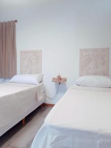 Duas camas sentadas uma ao lado da outra num quarto em La Vasca em Manuel B. Gonnet