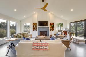 a living room with a couch and a fireplace at Tranquil Santa Rosa Home with Private Pool and Views! in Santa Rosa
