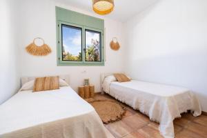 Postel nebo postele na pokoji v ubytování Casa Marisa en Riumar