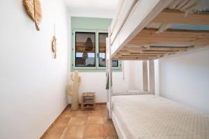 Postel nebo postele na pokoji v ubytování Casa Marisa en Riumar