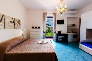 Postel nebo postele na pokoji v ubytování Don Giorgio Rooms & Apartments