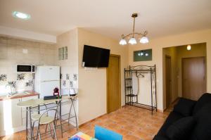 a kitchen and a living room with a refrigerator at Mediterranean Terraces - Sandy Beach in Villajoyosa