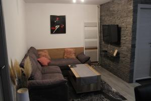 a living room with a couch and a tv at Sara in Višnjan