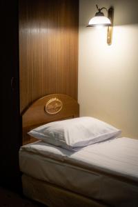 Postel nebo postele na pokoji v ubytování Hotel Górski