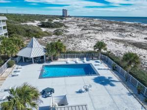 an overhead view of a swimming pool and a beach at Plantation 4206 in Gulf Shores
