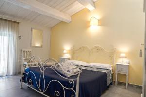 A bed or beds in a room at Il Fienile di Assisi