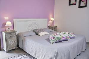 A bed or beds in a room at Il Fienile di Assisi