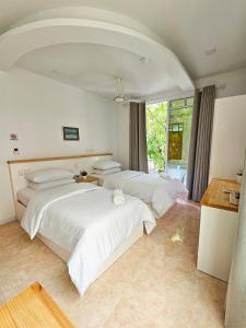 Postel nebo postele na pokoji v ubytování Keveli Guesthouse + 37 fotografií