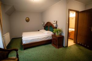 Postel nebo postele na pokoji v ubytování Hotel Górski