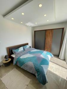 a bedroom with a large bed in a room at Axtart Penthouse with Amazing Views in Marsaxlokk