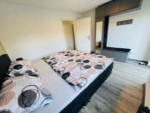 a bedroom with a bed and a projection screen at Traumhafte City-Wohnung in Mönchengladbach