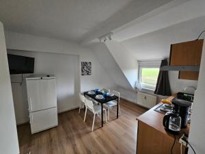 Kuchyň nebo kuchyňský kout v ubytování High Moon Apartment House in Nienburg with Wifi