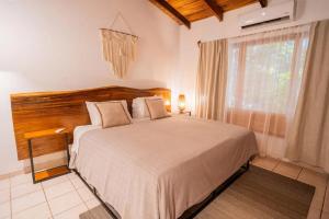 Ένα ή περισσότερα κρεβάτια σε δωμάτιο στο Curiol Boutique Hotel & Lounge