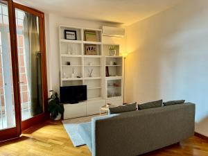 a living room with a couch and a tv at Flaminia home in Rome