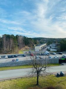 a parking lot with cars parked in a parking lot at Cozy room in a shared apartment close to nature in Gothenburg