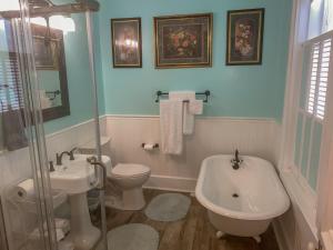 a bathroom with a toilet and a sink and a tub at Bed & Breakfast private room and bath in Elkhart +31 photos