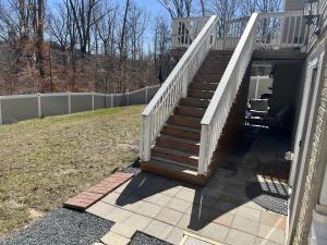 a stairway leading up to a house at Luxurious Basement Guest Suite in Elkridge in Elkridge