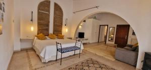 a bedroom with a bed and a living room at PETIT HOTEL ALGAIDA in Algaida +71 photos