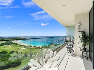 a balcony with a view of the ocean at Fourteen at Mullet Bay in Cupecoy