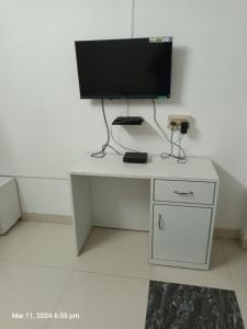 a desk with a computer monitor on top of it at Suryalaxmi guest house in Guwahati