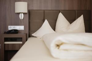 Postel nebo postele na pokoji v ubytování allgäu resort