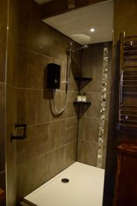 a bathroom with a shower with a shower at Hope and Anchor in Wirksworth