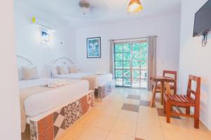 Postel nebo postele na pokoji v ubytování Hotel Szapot