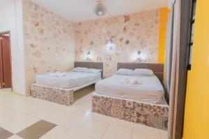 Postel nebo postele na pokoji v ubytování Hotel Szapot