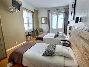 Postel nebo postele na pokoji v ubytování Atlantis Hôtel + 27 fotografií