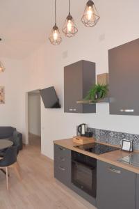 a kitchen with stainless steel cabinets and a counter top at Casa Ambra in Ancona