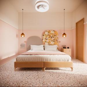 a bedroom with a large bed with a flower headboard at Asteria in Katastárion