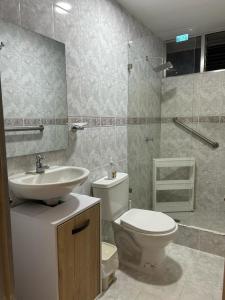 a bathroom with a toilet and a sink at Casa Verbena in Cisneros