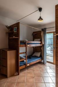 Кровать или кровати в номере Aldeia Caiçara Surf House