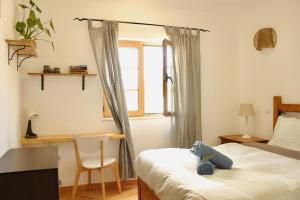 Кровать или кровати в номере Aldeia Caiçara Surf House