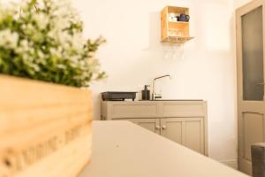 a kitchen with a counter top and a sink at Biciclò Mini Studio in Ferrara +12 photos