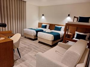 Postel nebo postele na pokoji v ubytování 3M Hostel & Suites