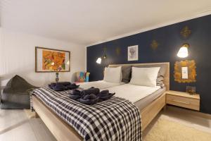 a bedroom with a bed with towels on it at Bárka Home in downtown Buda in Budapest